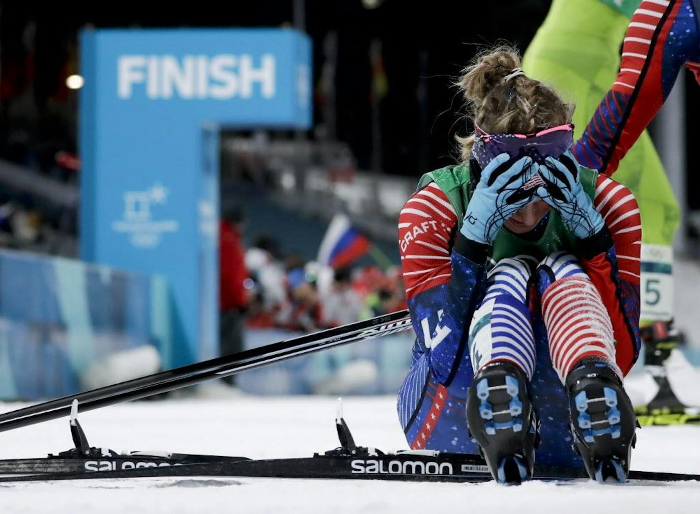 Jessie Diggins, of the United States, celebrates after winning the gold medal in the during women's team sprint freestyle cross-country skiing final at the 2018 Winter Olympics.