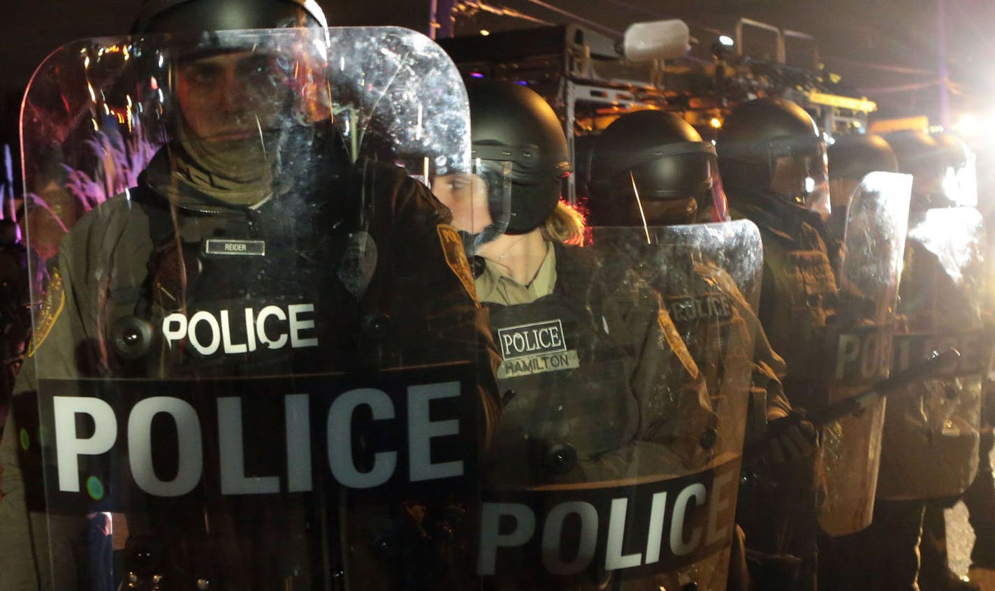 Police in riot gear lined up outside the police station in Ferguson, Mo., last November after a grand jury decision not to indict officer Darren Wilson in the death of Michael Brown.