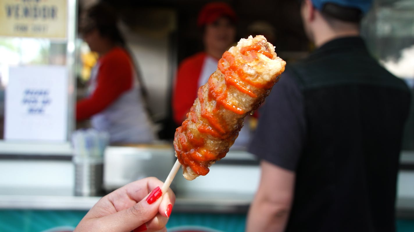 The giant egg roll on a stick at the new Minnesota State Fair stand, Que Viet.