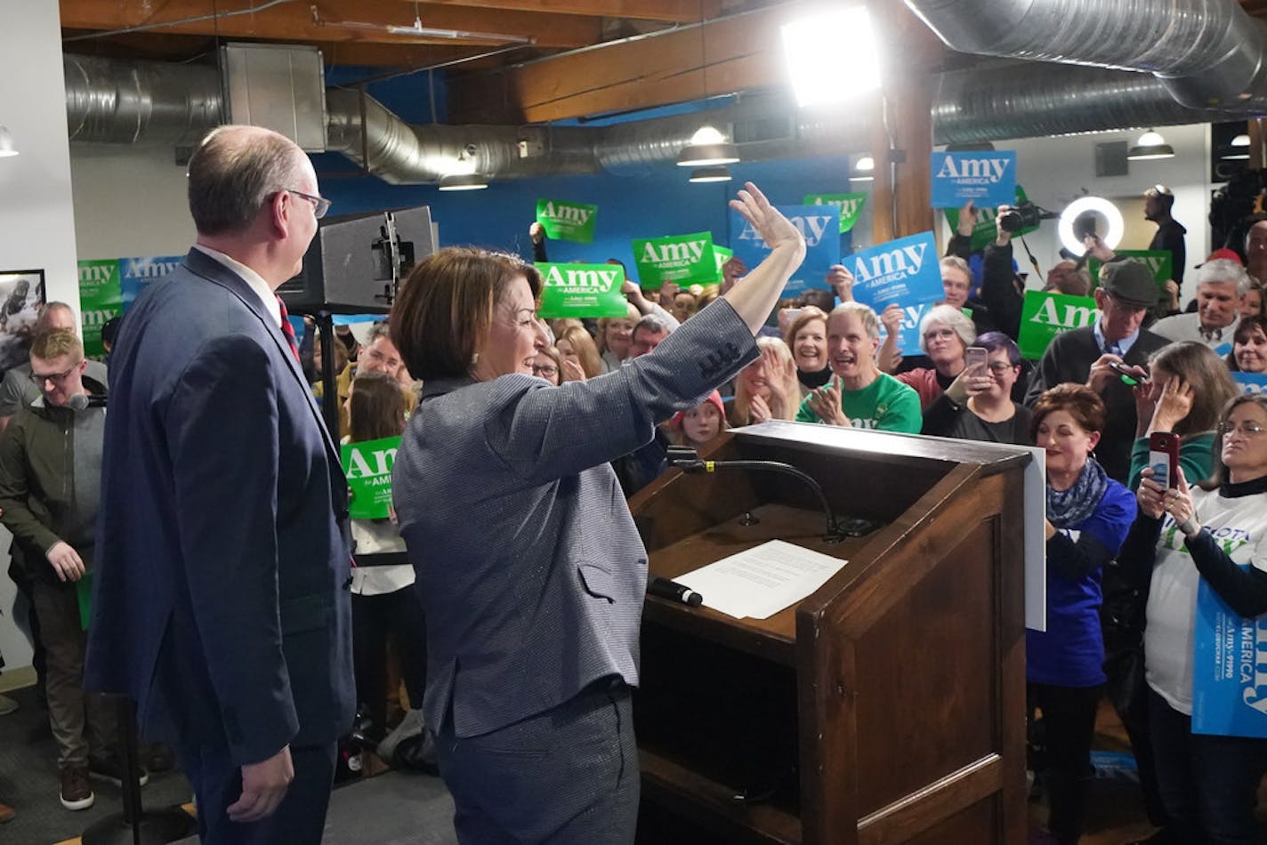 As results from the Nevada Democratic caucuses were coming in Saturday night, Amy Klobuchar and husband John Bessler greeted volunteers in Minneapolis.