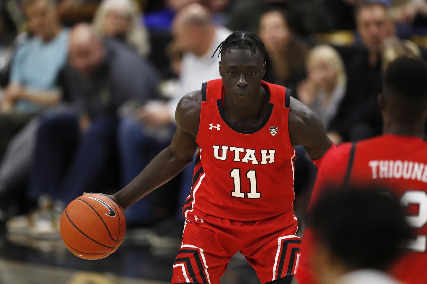 Utah guard Both Gach (11) in the first half of an NCAA college basketball game Sunday, Jan. 12, 2020, in Boulder, Colo. (AP Photo/David Zalubowski) ORG XMIT: OTKDZ164