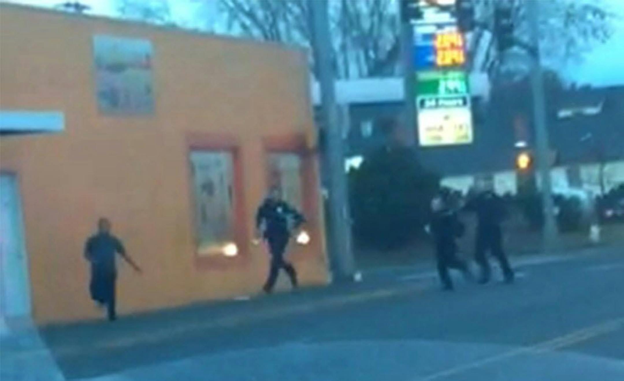 In this still frame taken from a cell phone video provided by Dario Infante and taken on Feb. 10, 2015, Antonio Zambrano-Montes, left, turns to face police officers while running from them in Pasco, Wash. Moments later he was shot and killed.