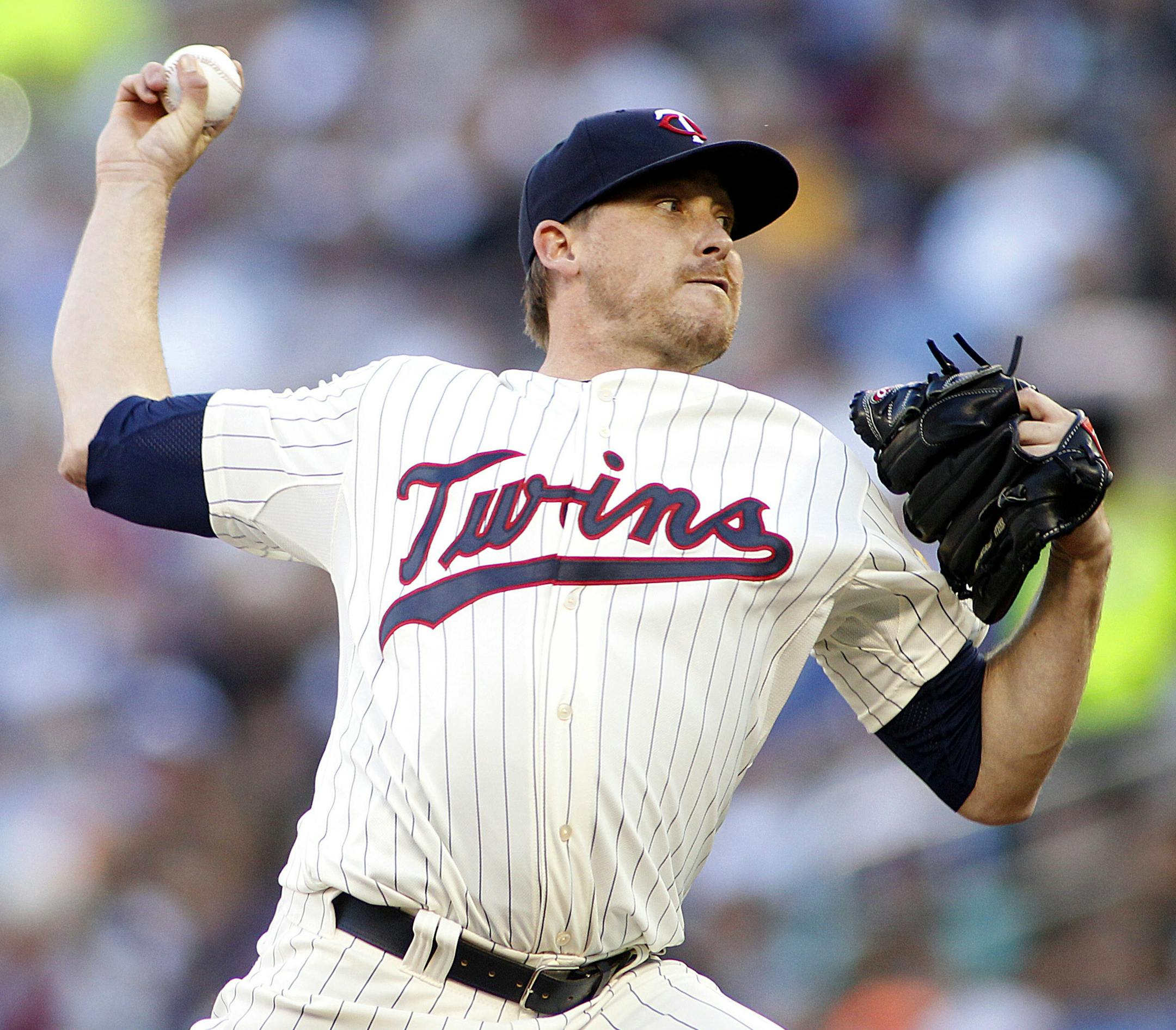 Minnesota Twins starting pitcher Kevin Correia throws to the Kansas City Royals in the first inning of a baseball game in Minneapolis, Wednesday, July 31, 2013. (AP Photo/Andy Clayton-King)