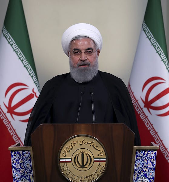 In this photo released by official website of the office of the Iranian Presidency, President Hassan Rouhani addresses the nation in a televised speec