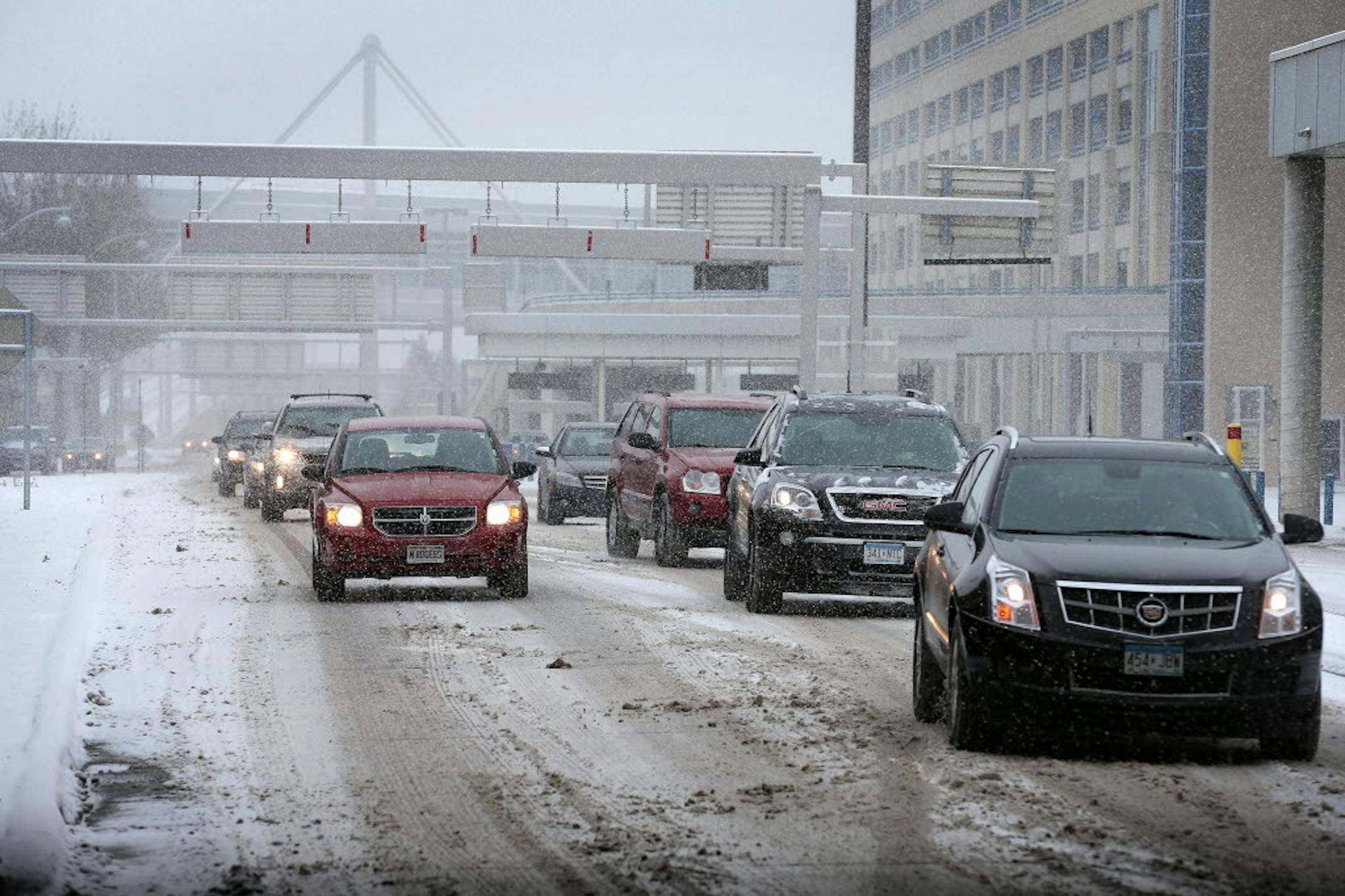 Cars enter the curbside pick-up area at Minneapolis-St. Paul International Airport's Terminal 1.