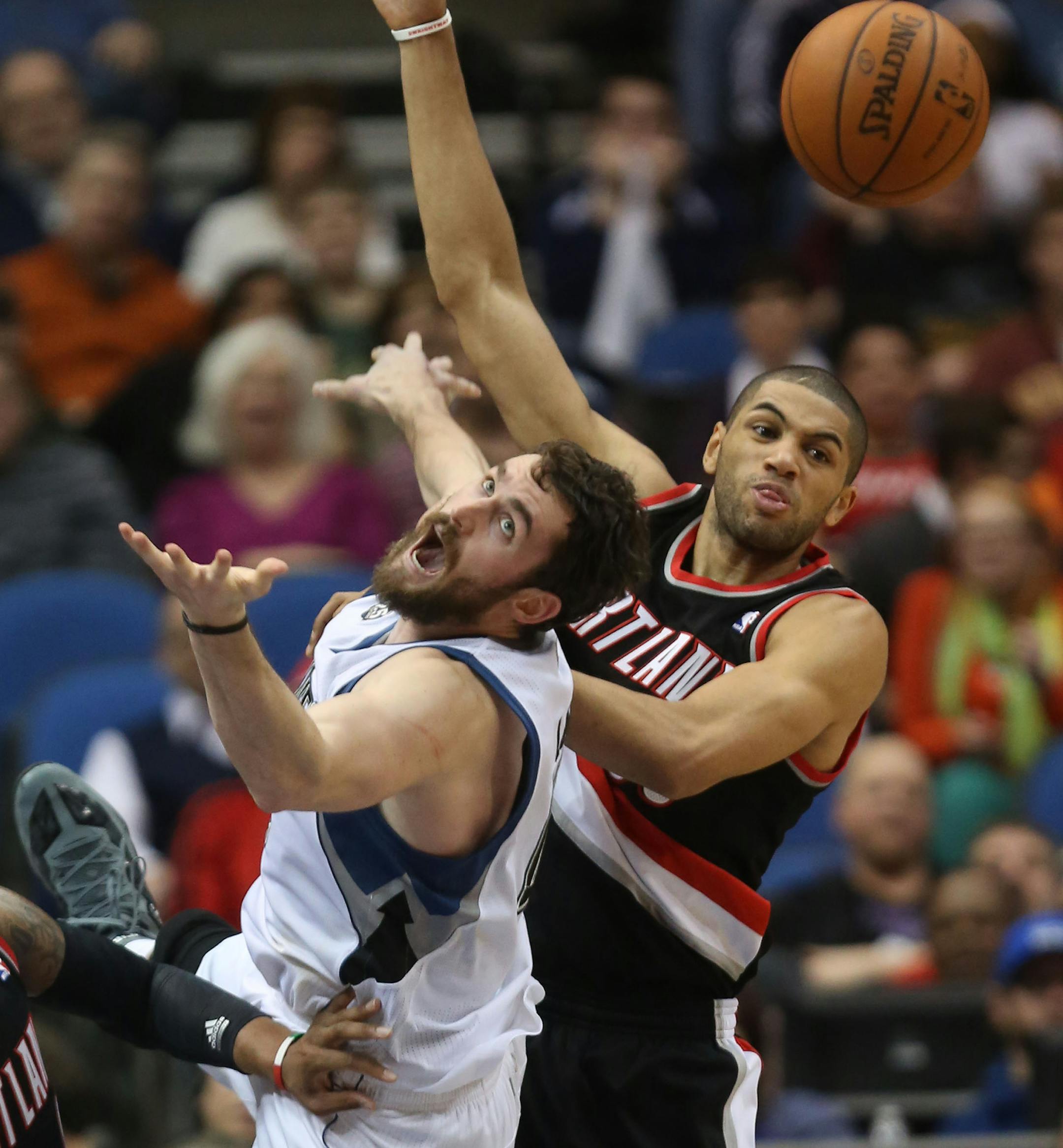 Wolves Kevin Love and Portland's Nicolas Batum went after a rebound during the second half at the Target Center in Minneapolis Wednesday, December 18, 2013. Wolves won over Portland 120-109. ] (KYNDELL HARKNESS/STAR TRIBUNE) kyndell.harkness@startribune.com