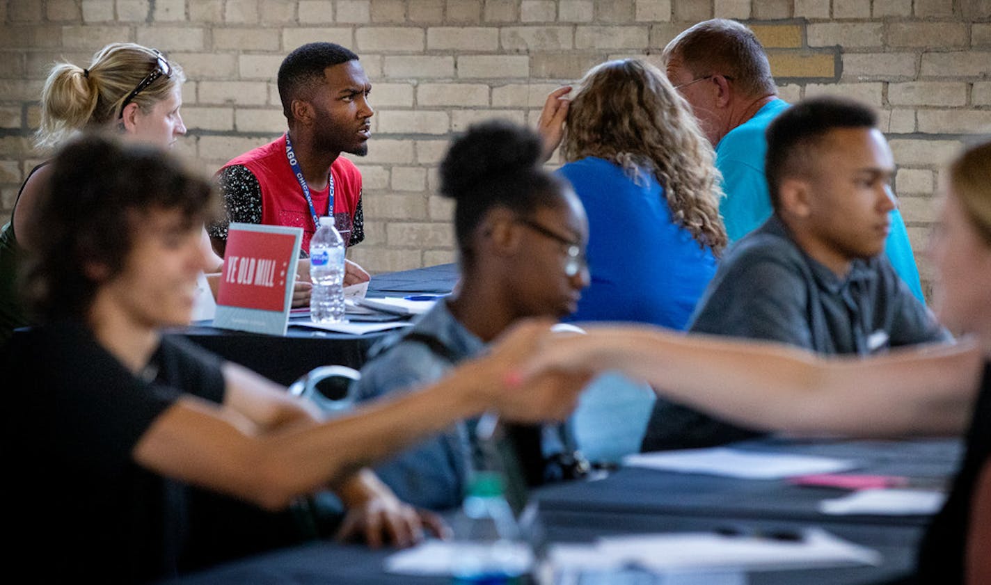 Interviews went on at multiple tables during a recent Minnesota State Job Fair.