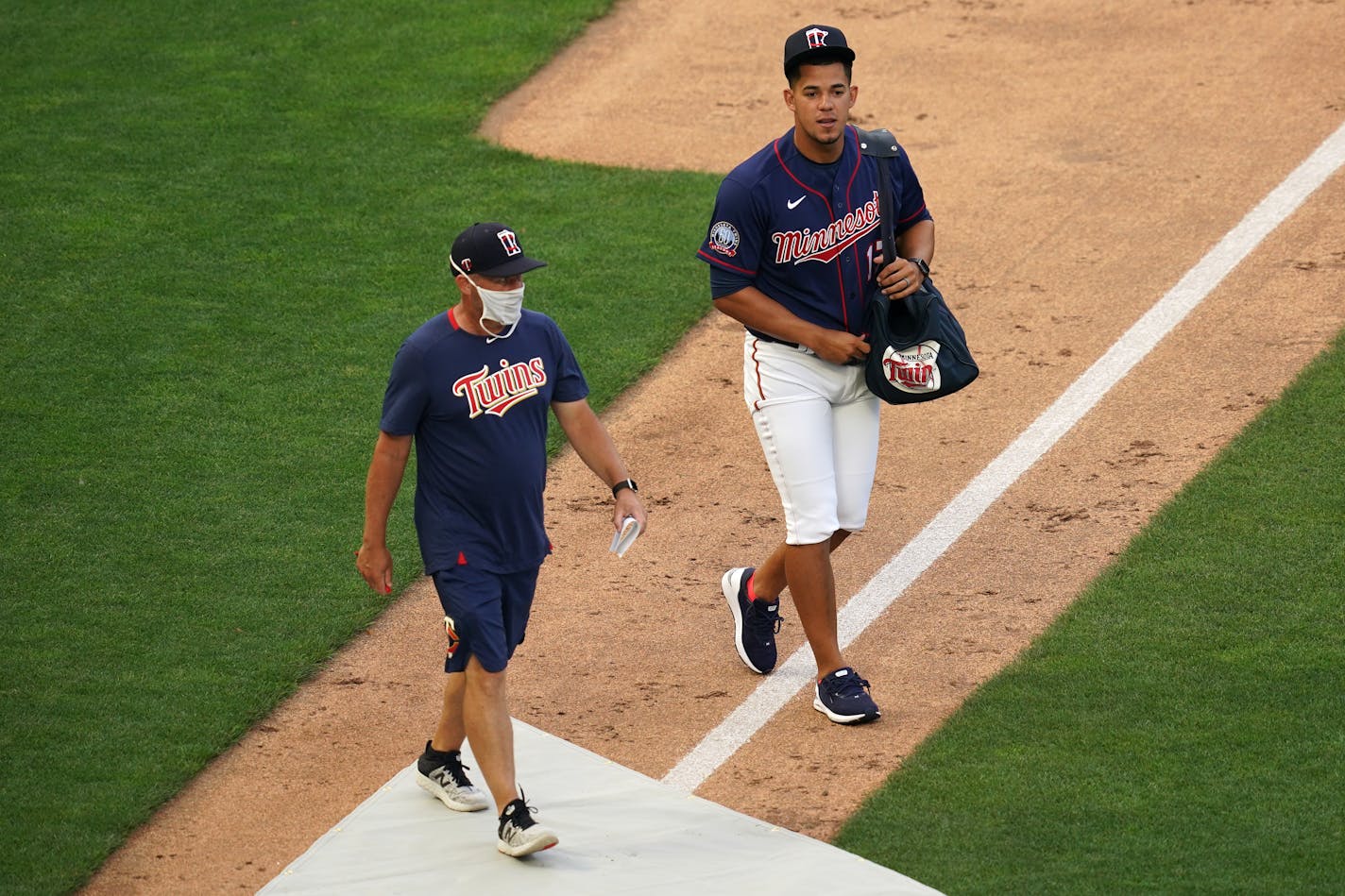 Twins pitcher José Berríos walked with pitching coach Wes Johnson as he took the field during practice last Friday.