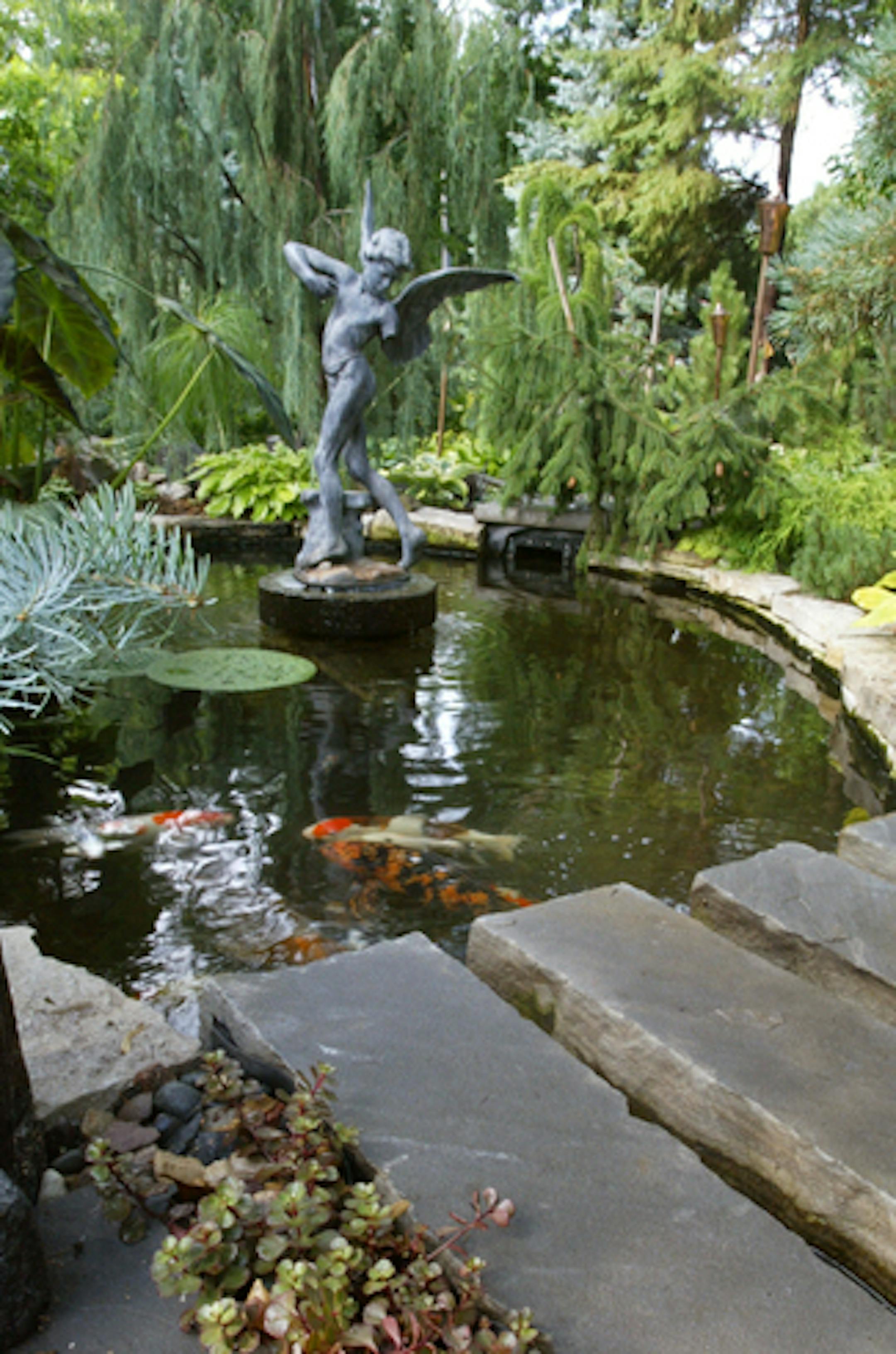 Joel Koyamaïjkoyama@startribune.com Beautiful Garden cover story on Ted Bair and Harvey Filister's formal Minneapolis garden. On a small city lot, the two -- working under Ted's direction -- have created a very formal garden, with a pond, antique fountain, topiary trees and cobblestone walkways all outlined with immaculately trimmed hedges.