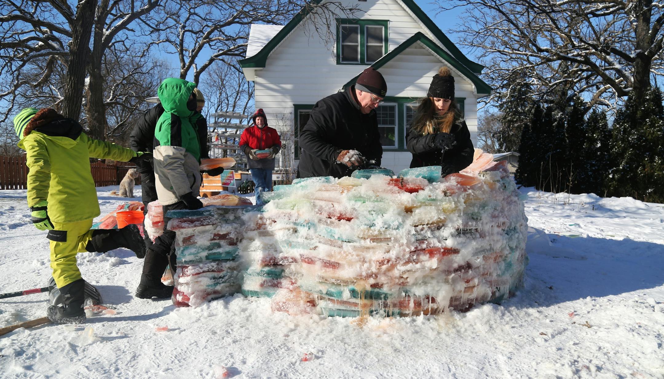 Martha Palm, her family and some former students of hers will be working on the multi-colored igloo they are building at the Palms' south Minneapolis home and seen Saturday, Dec. 30, 2017, in Minneapolis, MN. Here, Martha Palm and her family and the Zirps family, neighbors and some Martha's former students did most of the building of the igloo.