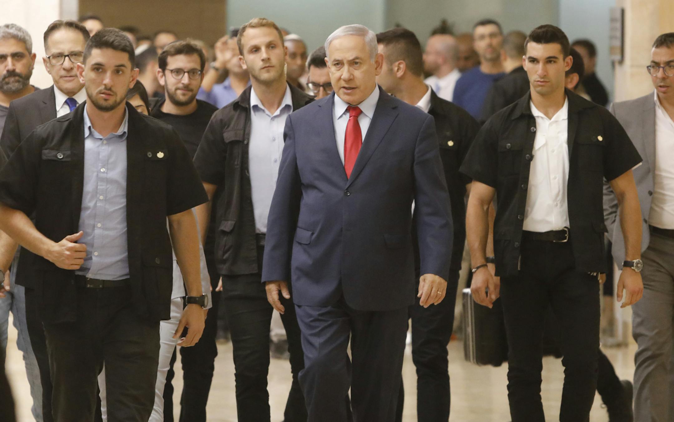 Israeli Prime Minister Benjamin Netanyahu walks in the Knesset, Israel's parliament, in Jerusalem, Wednesday, May 29, 2019. Israeli Prime Minister Benjamin Netanyahu faced a deadline at midnight Wednesday to form a new governing coalition as he tried to stave off a crisis that could trigger an unprecedented second election this year or even force the longtime leader to step down.. (AP Photo/Sebastian Scheiner)
