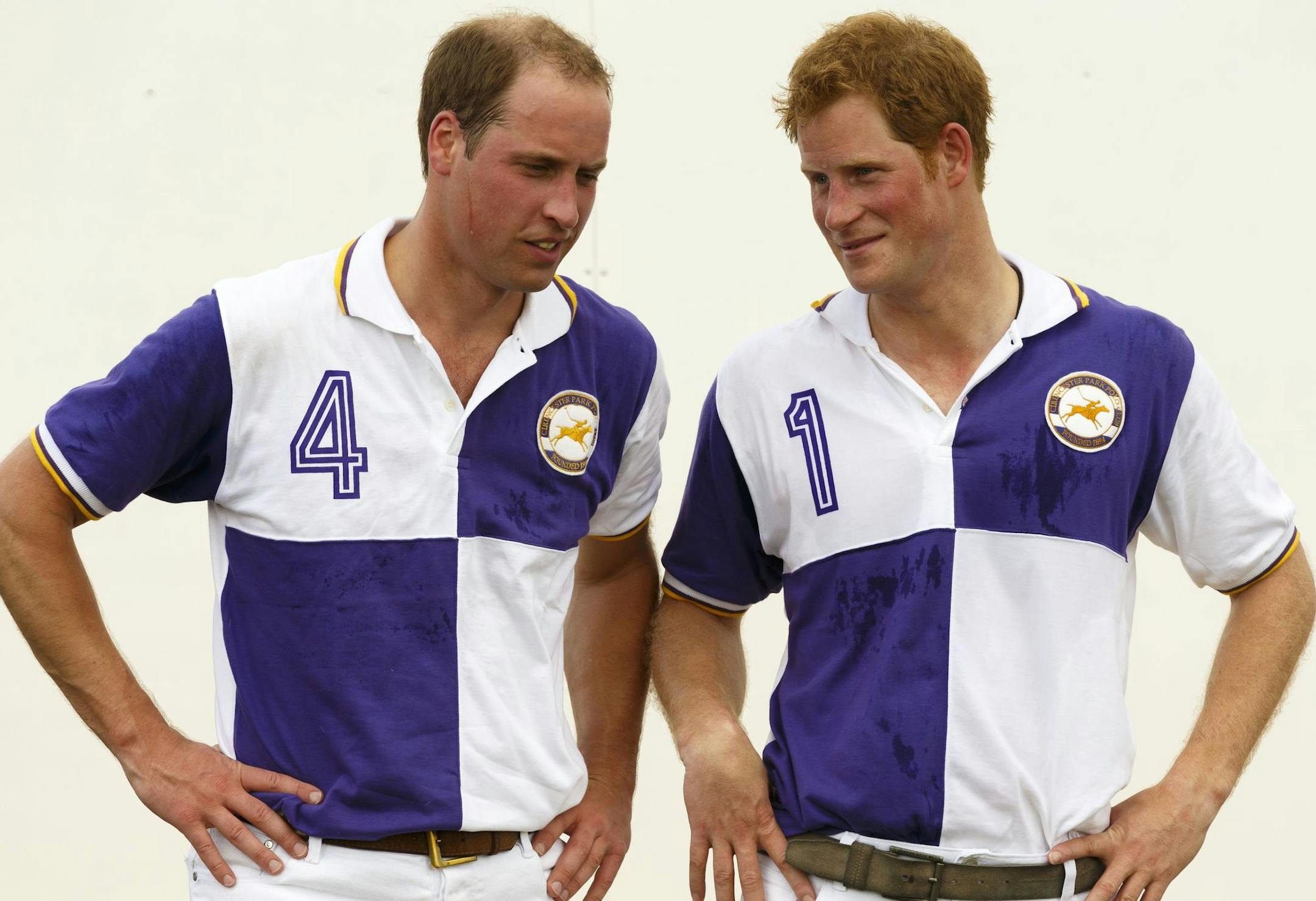 Prince William, the Duke of Cambridge, right, and Prince Harry chat after The Jerudong Trophy at Cirencester Park Polo Club in Gloucestershire Sunday July 14, 2013. Many in the British press have predicted that the first child of the prince and the Duchess of Cambridge, formerly known as Kate Middleton, was expected to arrive on Sunday but the prince was enjoying a game of polo against his brother Prince Harry at a charity event. (AP Photo/ Chris Ison, PA) UNITED KINGDOM OUT - NO SALES - NO ARCH
