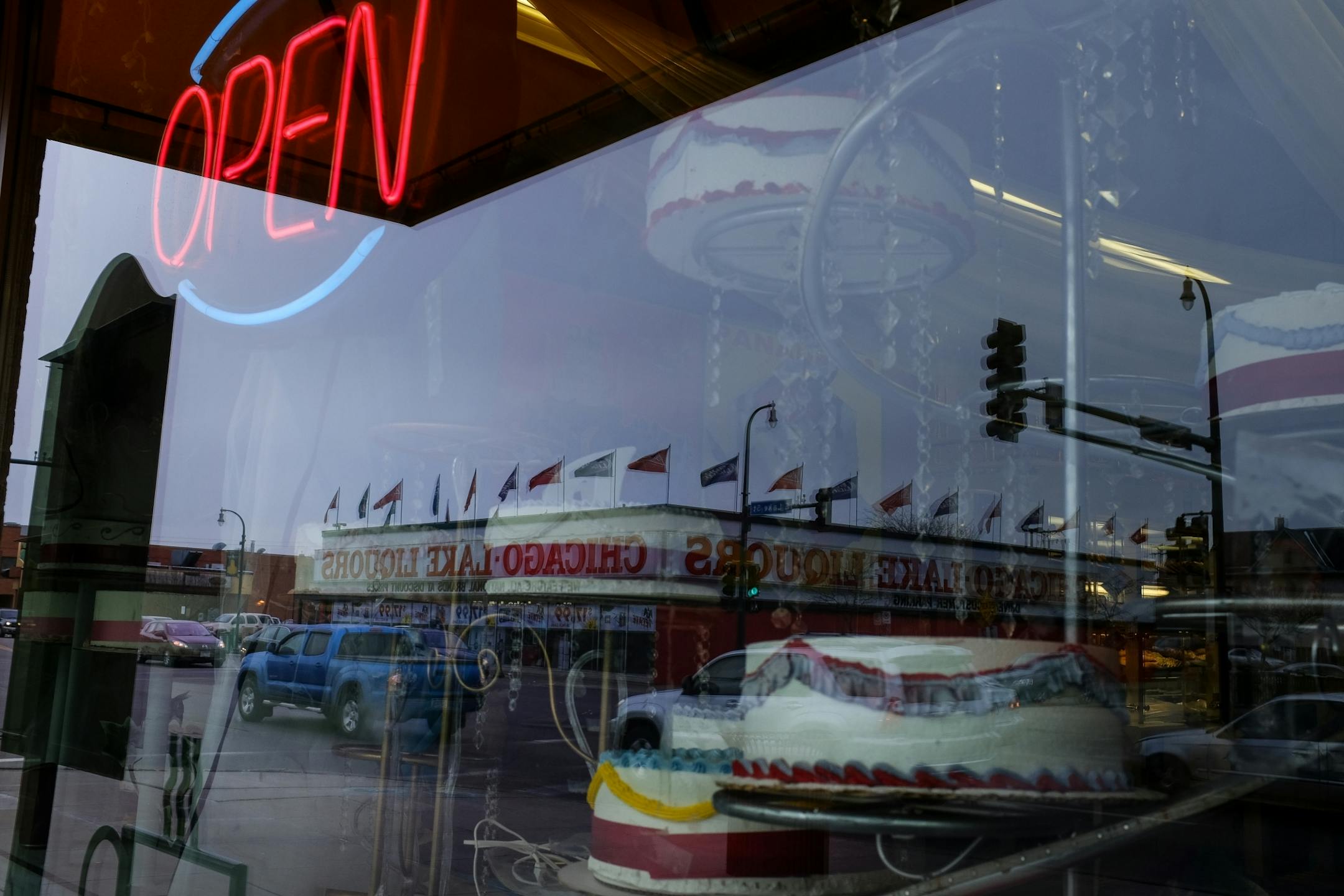 Chicago Lake Liquors was reflected in the window of the Midtown Global Market Friday afternoon.