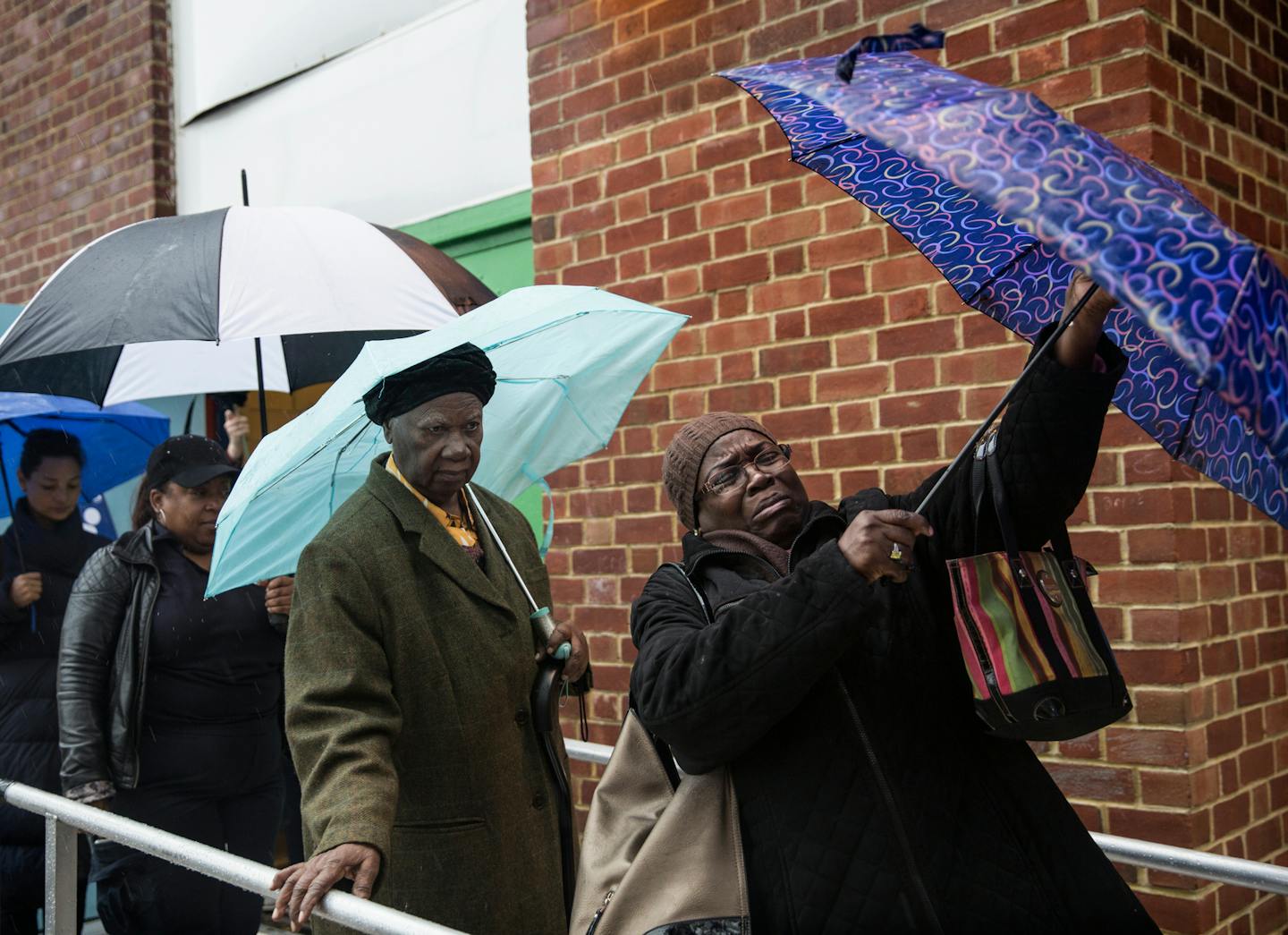 Voters exit the polling station at the Bedford Village School in Brooklyn, New York, Nov. 6, 2018. A two-page ballot appears to have caused havoc for scanning machines at polling places across New York City, as scores of broken scanners brought voting to a standstill at many locations on Tuesday. (Holly Pickett/The New York Times)