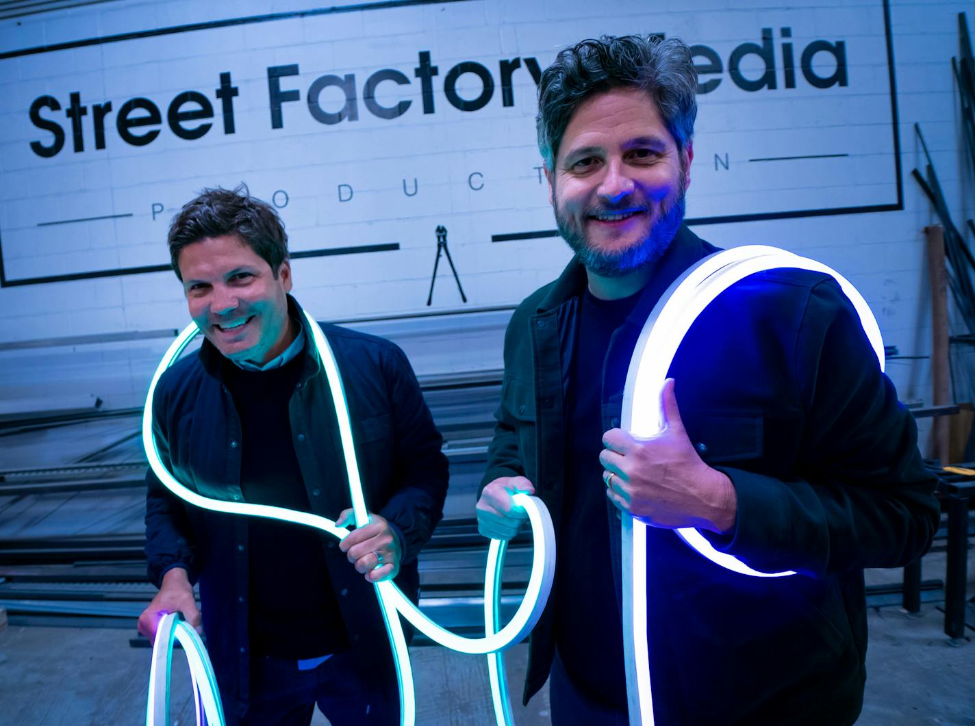 Street Factory Media owners Matt Kelly, left, and Jim Audette played with LED lighting the firm is using for a display they are building for a tech company.