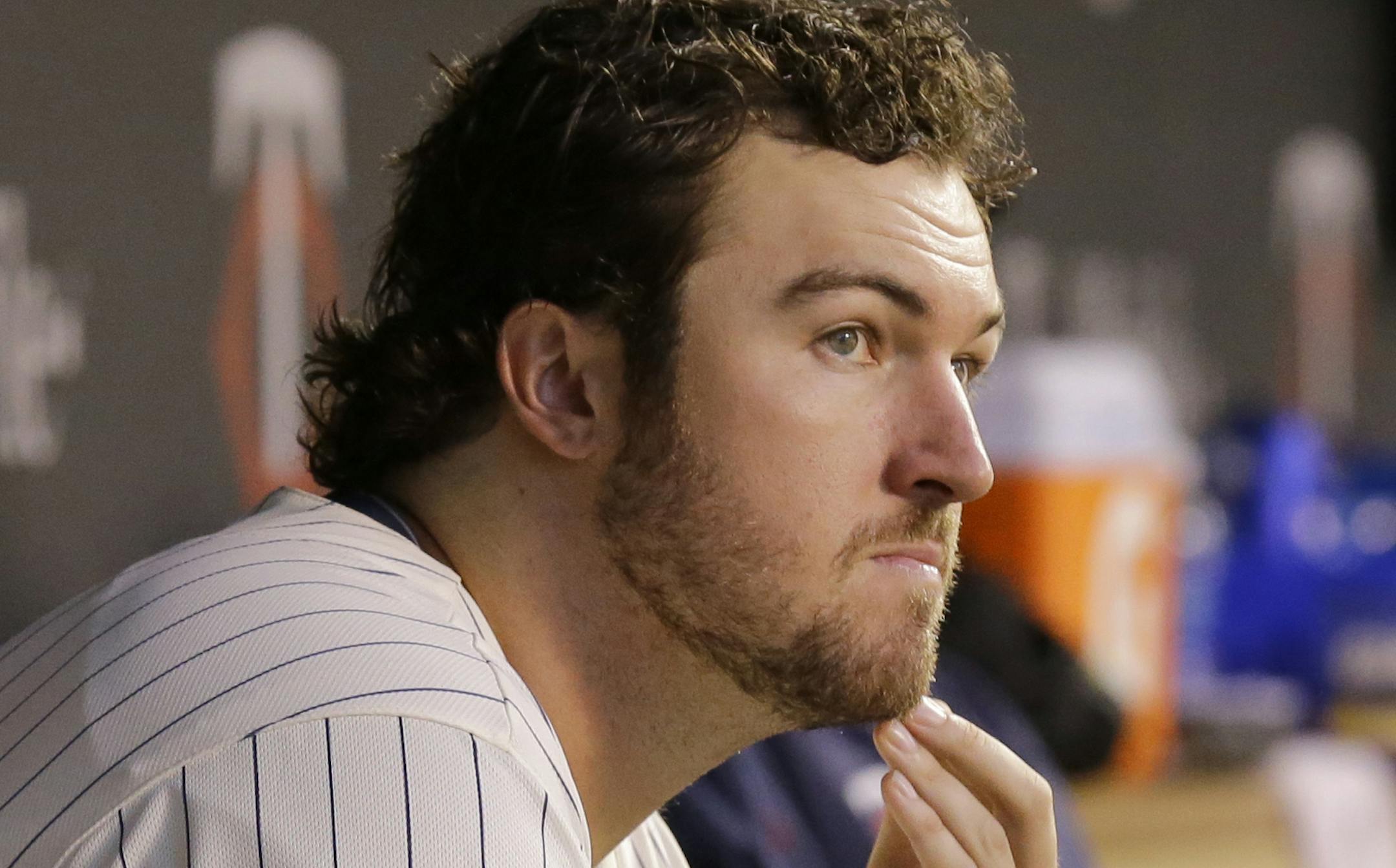 Minnesota Twins pitcher Phil Hughes sits in the dugout during the fourth inning of a baseball game against the Los Angeles Angels in Minneapolis, Saturday, Sept. 6, 2014. (AP Photo/Ann Heisenfelt) ORG XMIT: MIN2014091118581507