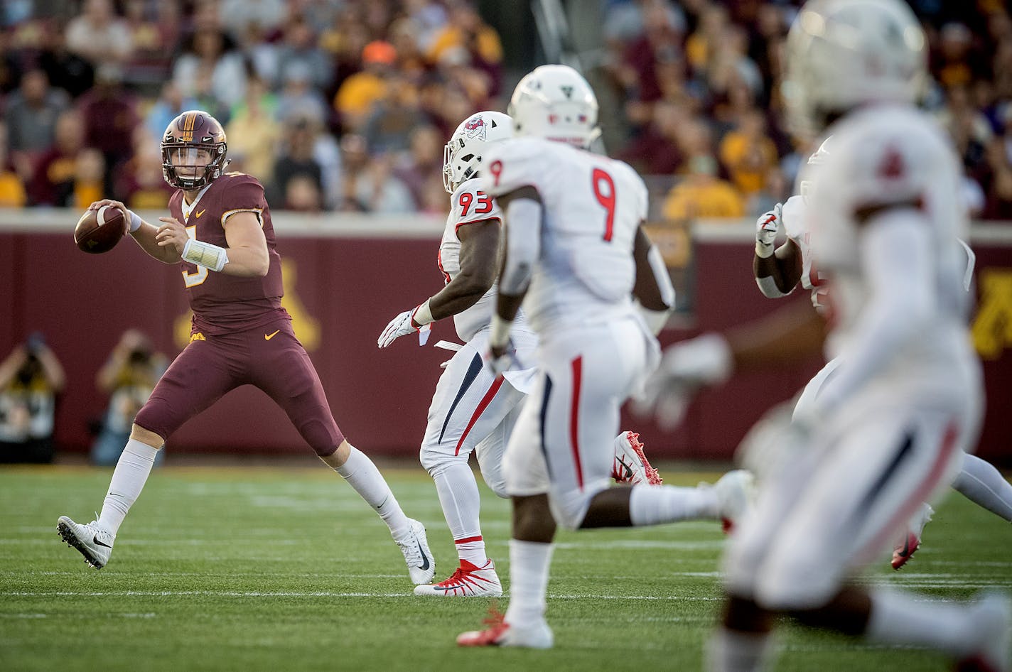 Minnesota freshman quarterback Zack Annexstad looked down field for a pass in the first quarter