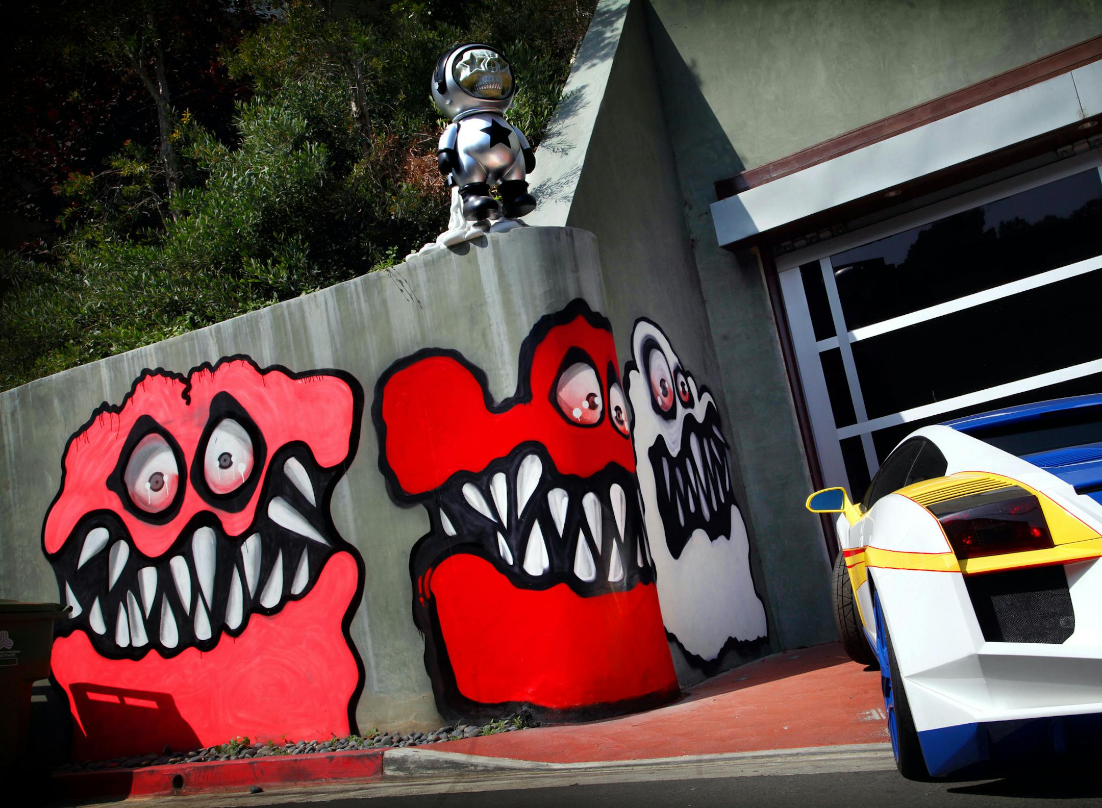 This May 10, 2013 photo shows Graffiti painted on the walls of the home of entertainer Chris Brown in Hollywood Hills, Calif. Neighbors are angry at Brown's street art painted outside his home and local residents are calling for fines to be brought against the pop star and demanding Brown remove the street art. (AP Photo/Los Angeles Times, Barbara Davidson) NO FORNS; NO SALES; MAGS OUT; ORANGE COUNTY REGISTER OUT; LOS ANGELES DAILY NEWS OUT; VENTURA COUNTY STAR OUT; INLAND VALLEY DAILY BULLETIN