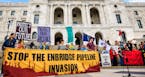 Pipeline opponents rallied on the steps of the State Capitol to oppose the proposed Enbridge Line 3 tar sands pipeline expansion. ] GLEN STUBBE &#xef;