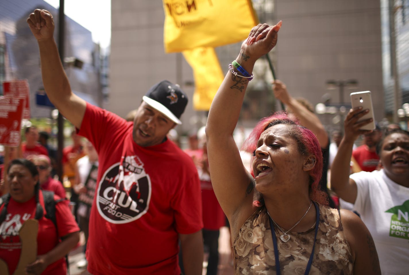 Supports of a $15 minimum wage chanted as they rallied before marching around City Hall and delivering the petition. ] JEFF WHEELER &#xef; jeff.wheeler@startribune.com Supporters of an $15 minimum wage amendment to the Minneapolis City Charter rallied at City Hall before presenting the City Clerk with a petition signed by 20,000 residents Wednesday afternoon, June 29, 2016.