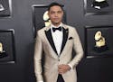 FILE - Trevor Noah arrives at the 62nd annual Grammy Awards in Los Angeles on Jan. 26, 2020. Noah has been tapped to host the 2021 Grammy Awards. The 