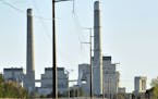 File- This Oct. 20, 2010, file photo shows Xcel Energy&#xed;s Sherco Power Plant in Becker, Minn. Minnesota, which already successfully lowered carbon