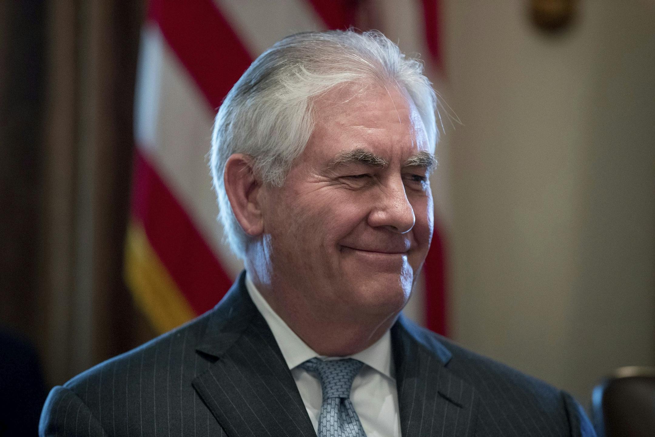 Secretary of State Rex Tillerson smiles as President Donald Trump speaks during a Cabinet meeting in the Cabinet Room of the White House in Washington, Monday, March 13, 2017. (AP Photo/Andrew Harnik)