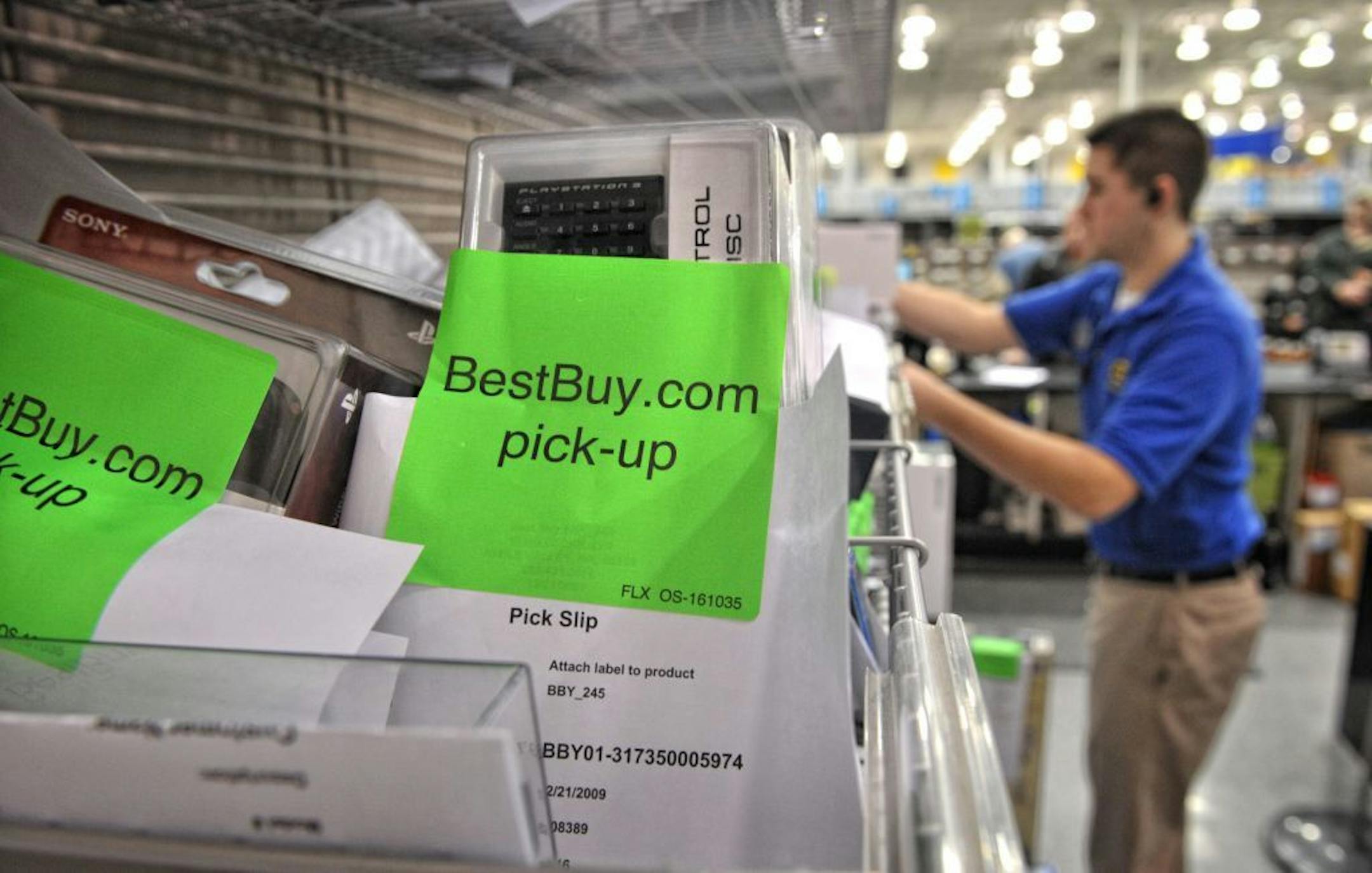 Matt Phillips pulled an item for a customer who ordered the item on line and picked it up at the service desk of the Apple Valley Best Buy Store.