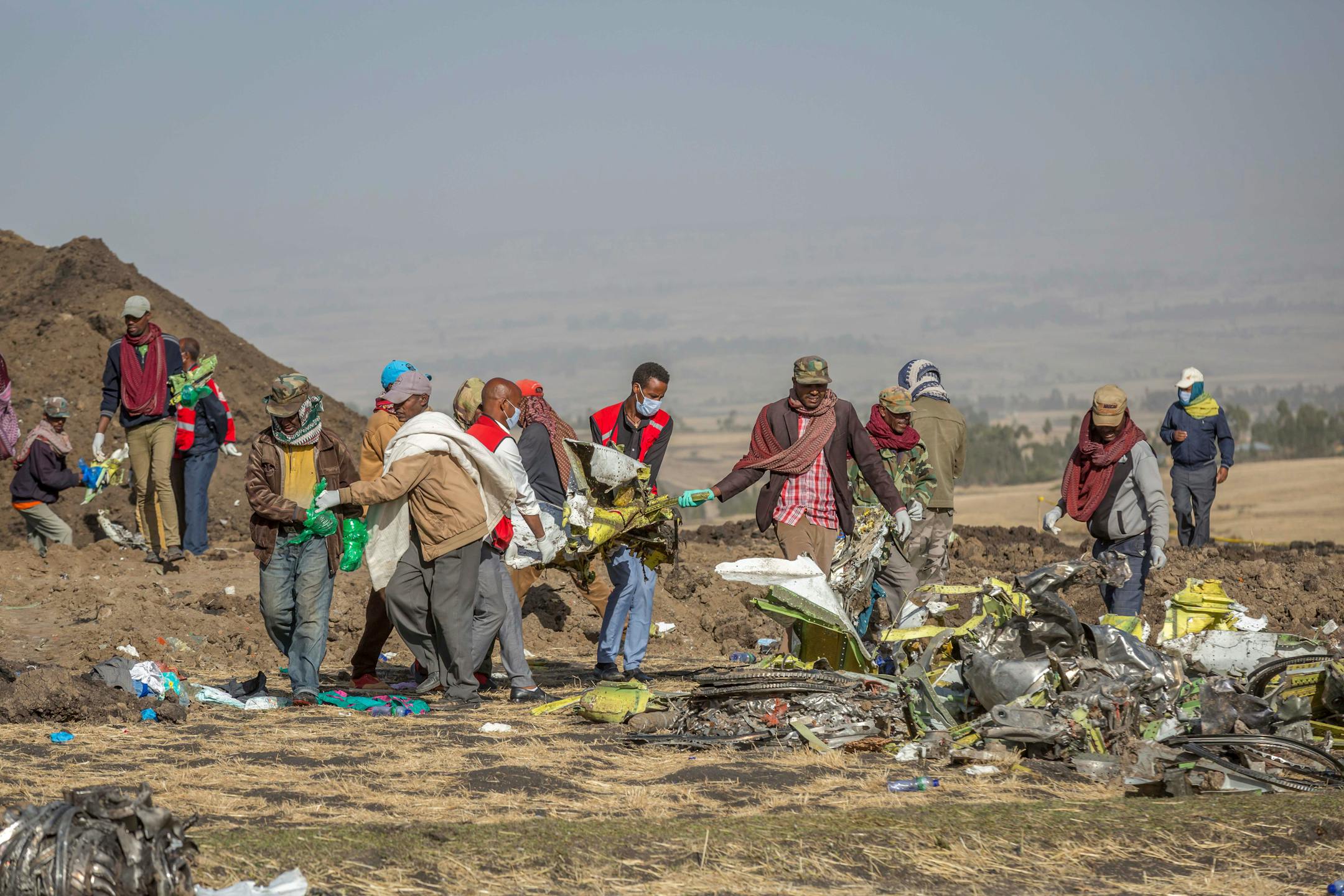 Rescuers work at the scene of an Ethiopian Airlines flight crash near Bishoftu, or Debre Zeit, south of Addis Ababa, Ethiopia, Monday, March 11, 2019.