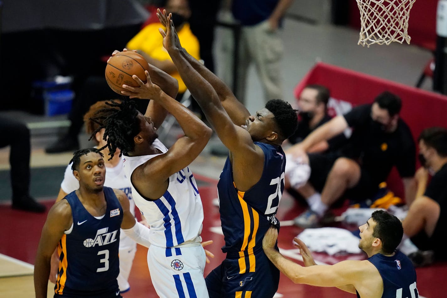 The Clippers reportedly are including former Gophers center Daniel Oturu (left) in a deal to acquire Memphis point guard Eric Bledsoe.