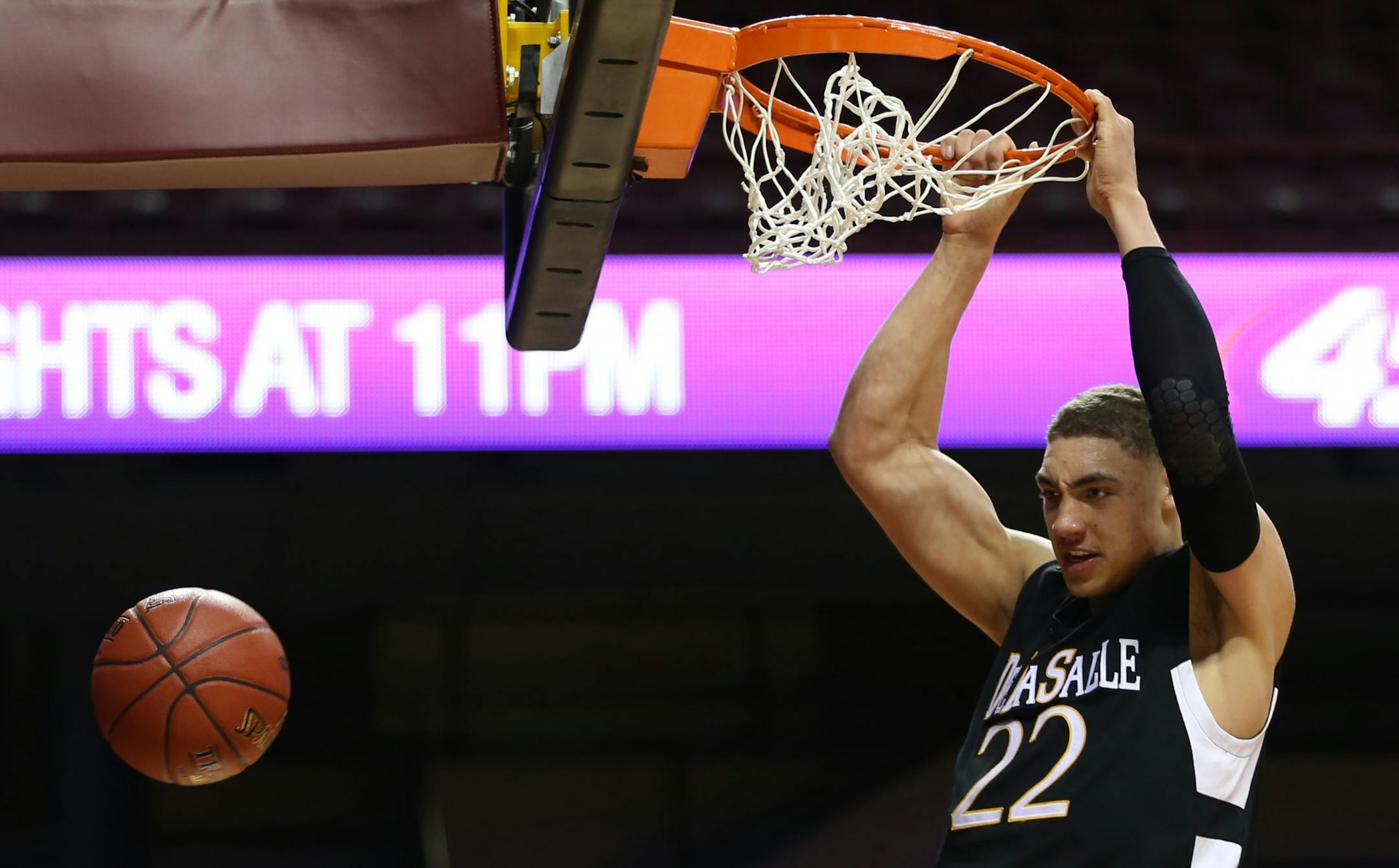 (left to right) DeLaSalle's Reid Travis jammed the ball for a basket in second half action against St. Paul Central.