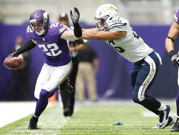 Minnesota Vikings free safety Harrison Smith (22) was pushed out of bounds after intercepting a pass by San Diego Chargers tight end Hunter Henry (86)