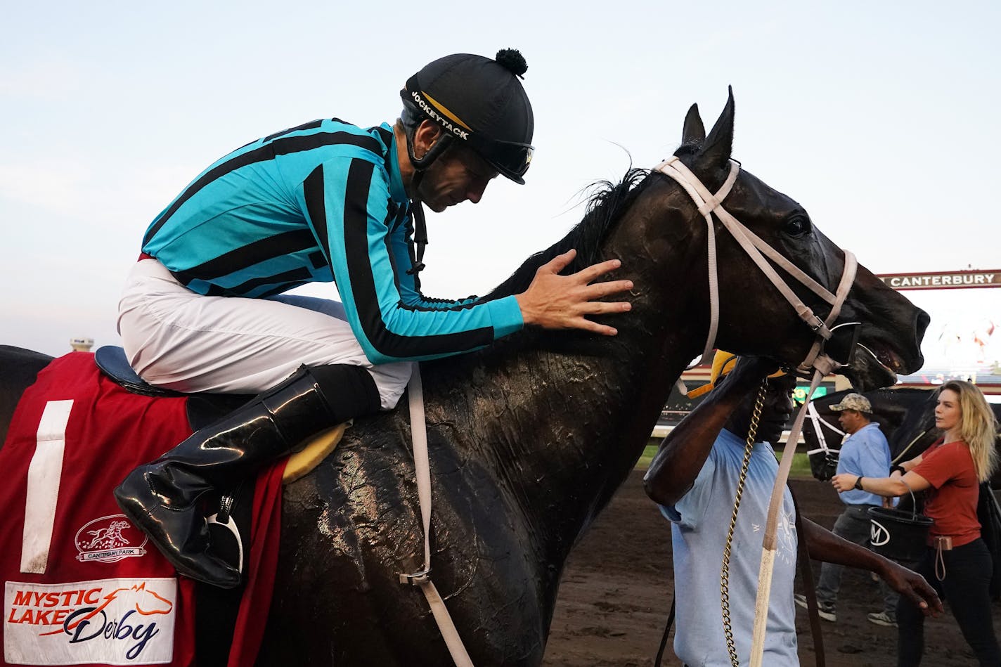 Jockey Jareth Loveberry gave a pat to King Of Miami, son of American Pharoah, after he beat out Modern Science and favorite T-D Dance to win the Mystic Lake Derby on the turf Wednesday at Canterbury Park. ] ANTHONY SOUFFLE • anthony.souffle@startribune.com