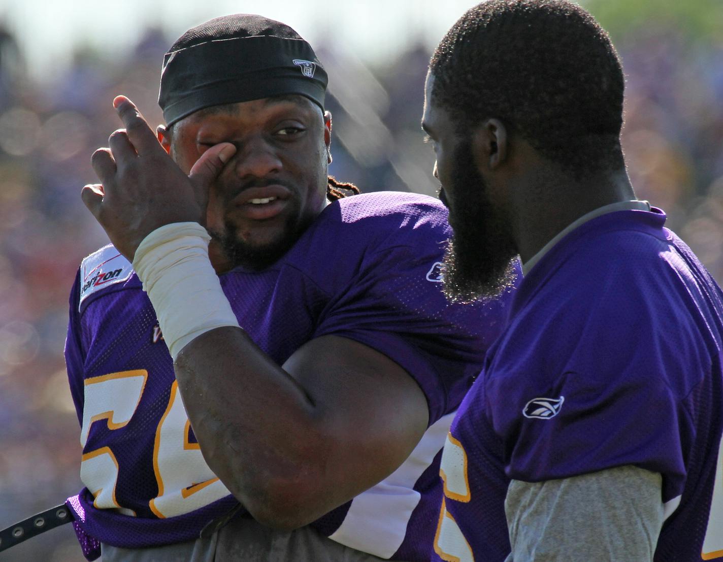 Former Minnesota Vikings E.J. Henderson and Kenny Onatolu talked during training camp in 2011