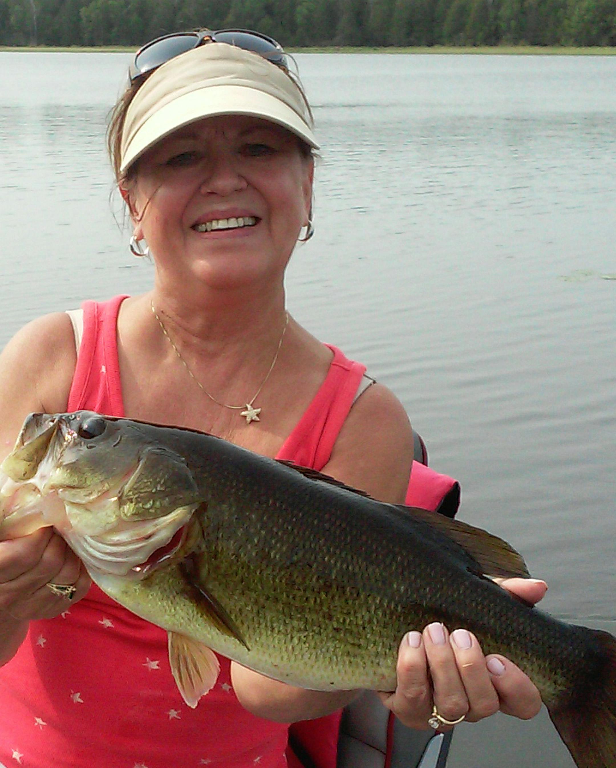 FIRST BASS Susan Hanninen of Crystal caught and released her first bass on Lake Waukenabo near Aitkin while pan fishing with her husband, Bill, and neighbor Tom Fodstad. The beauty was 19 inches and weighed 4.5 pounds.