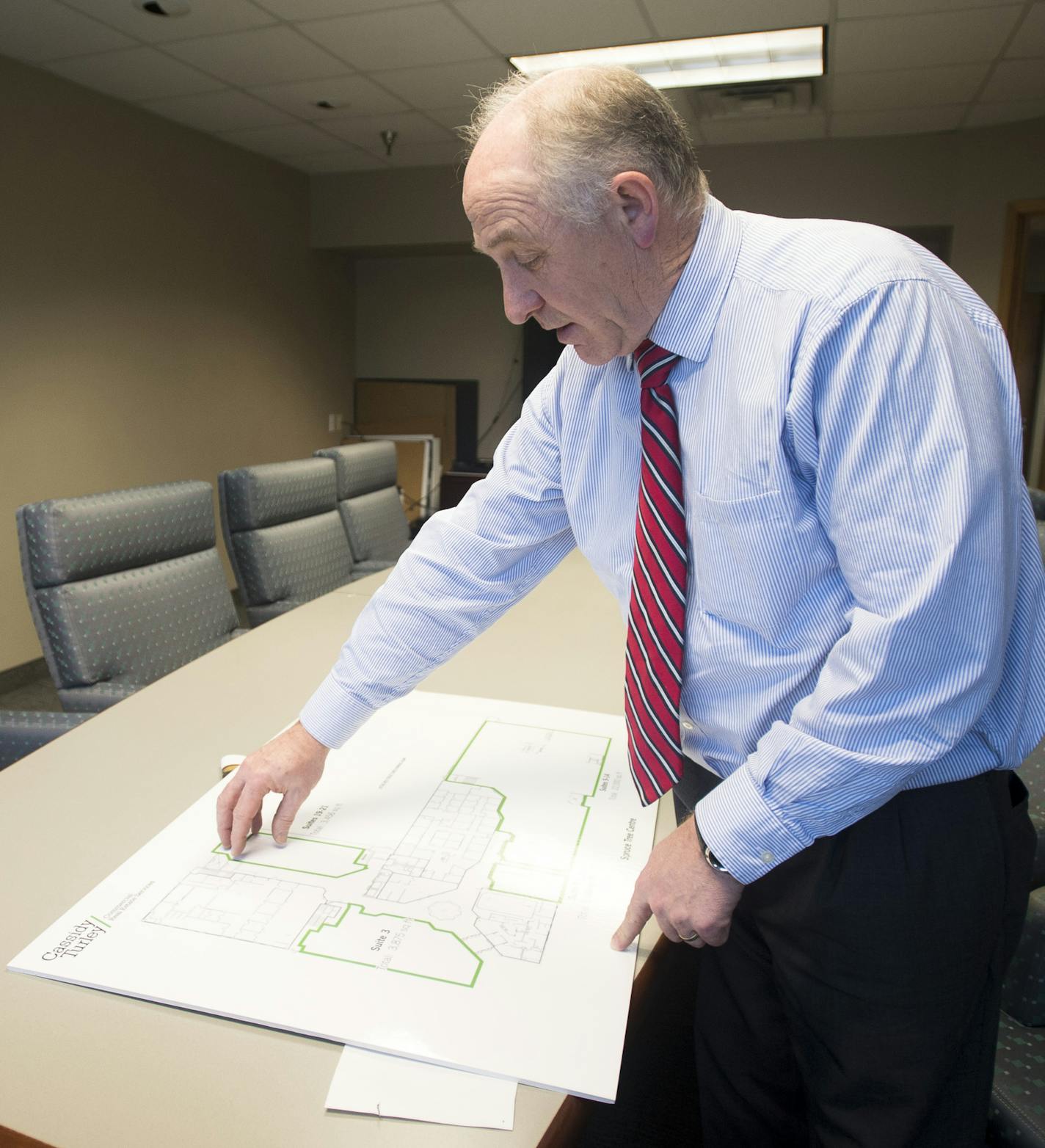 Michael Koch, executive vice president of MetroPlains Management Service, discusses some of the renovations underway at the Spruce Tree Centre which include new flooring, walls, lighting, accents and storefronts. ] (Aaron Lavinsky | StarTribune) $1 million renovation about to get underway at the Spruce Tree Center, the odd-duck, green-clad office/retail building at Snelling & University in St. Paul. Built in 1987, the Spruce Tree has had its ups-and-downs over the years, but has always been extr