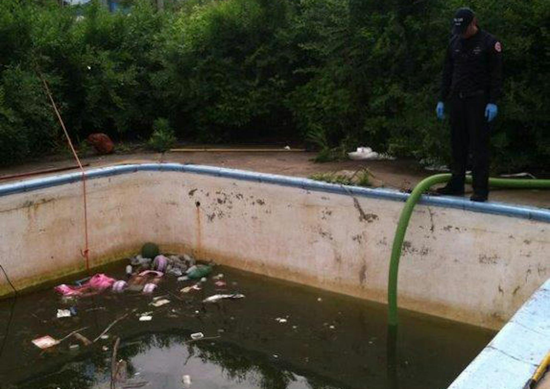 An abandoned pool at 1221 Arundel St. is now filled with about 6 feet of filthy water.
