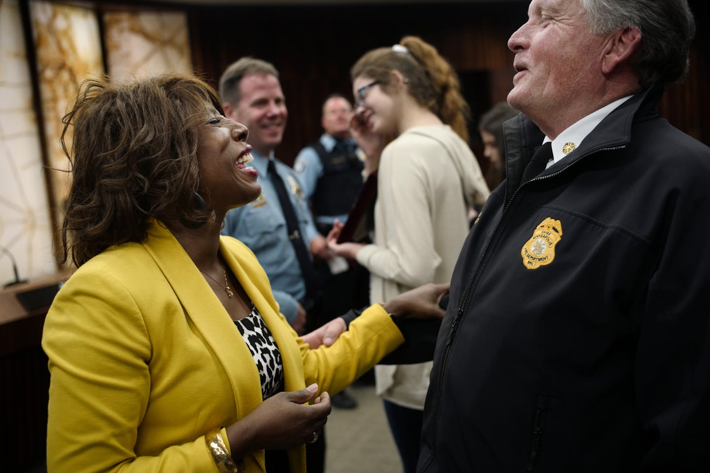 Minnehaha Academy president Donna Harris greeted Fire Chief John Fruetel after he received his award. ] Eight first responders to the site of the deadly explosion at Minnehaha Academy will be honored by Hennepin County today.Richard Tsong-Taatarii/Richard.tsong-taatarii@startribune.com