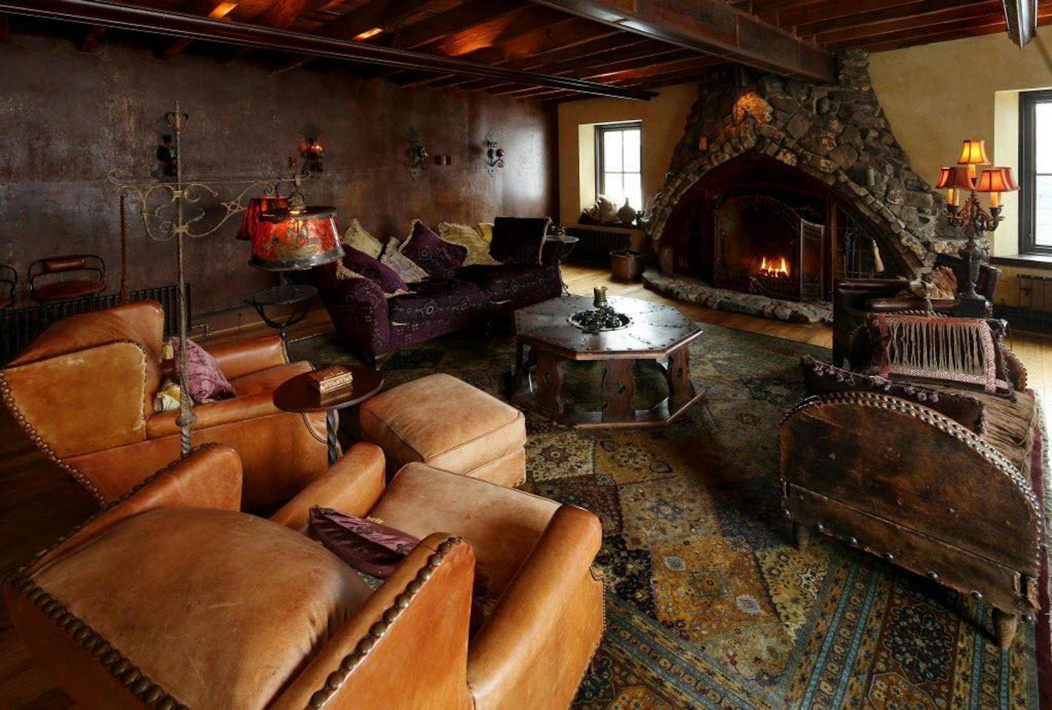 The great room has a massive stone fireplace.