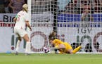 United States goalkeeper Alyssa Naeher saves a penalty from England's Steph Houghton during the Women's World Cup semifinal soccer match between Engla
