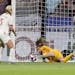 United States goalkeeper Alyssa Naeher saves a penalty from England's Steph Houghton during the Women's World Cup semifinal soccer match between Engla