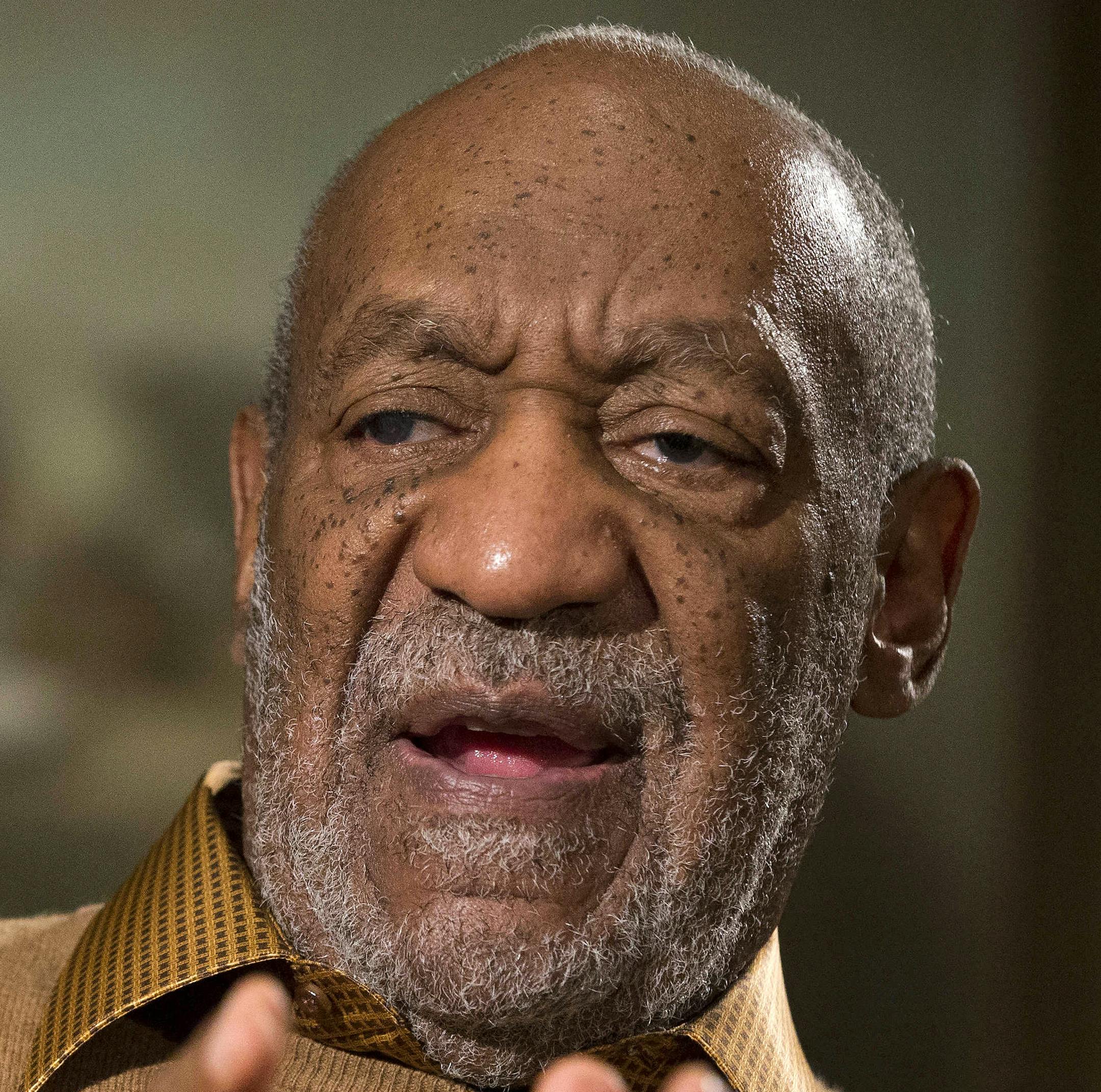 FILE - In this Nov. 6, 2014 file photo, entertainer Bill Cosby gestures during an interview at the Smithsonian's National Museum of African Art in Washington. Lawyers for Bill Cosby argue in a new court filing his admission he used quaaludes in the 1970s doesn't mean he drugged and sexually assaulted women. The lawyers on Tuesday, July 21, 2015, asked a court to preserve the confidentiality of his 2006 settlement in a sexual-battery lawsuit. (AP Photo/Evan Vucci, File)