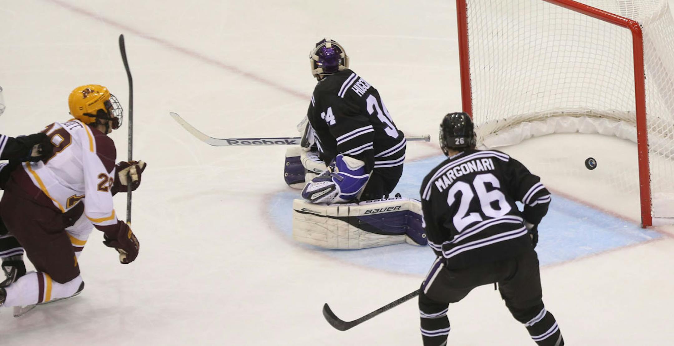 The Gophers' Jake Bischoff scored the first goal of the game against Minnesota State Mankato goalie Cole Huggins during the first period at Mariucci Arena on Saturday.