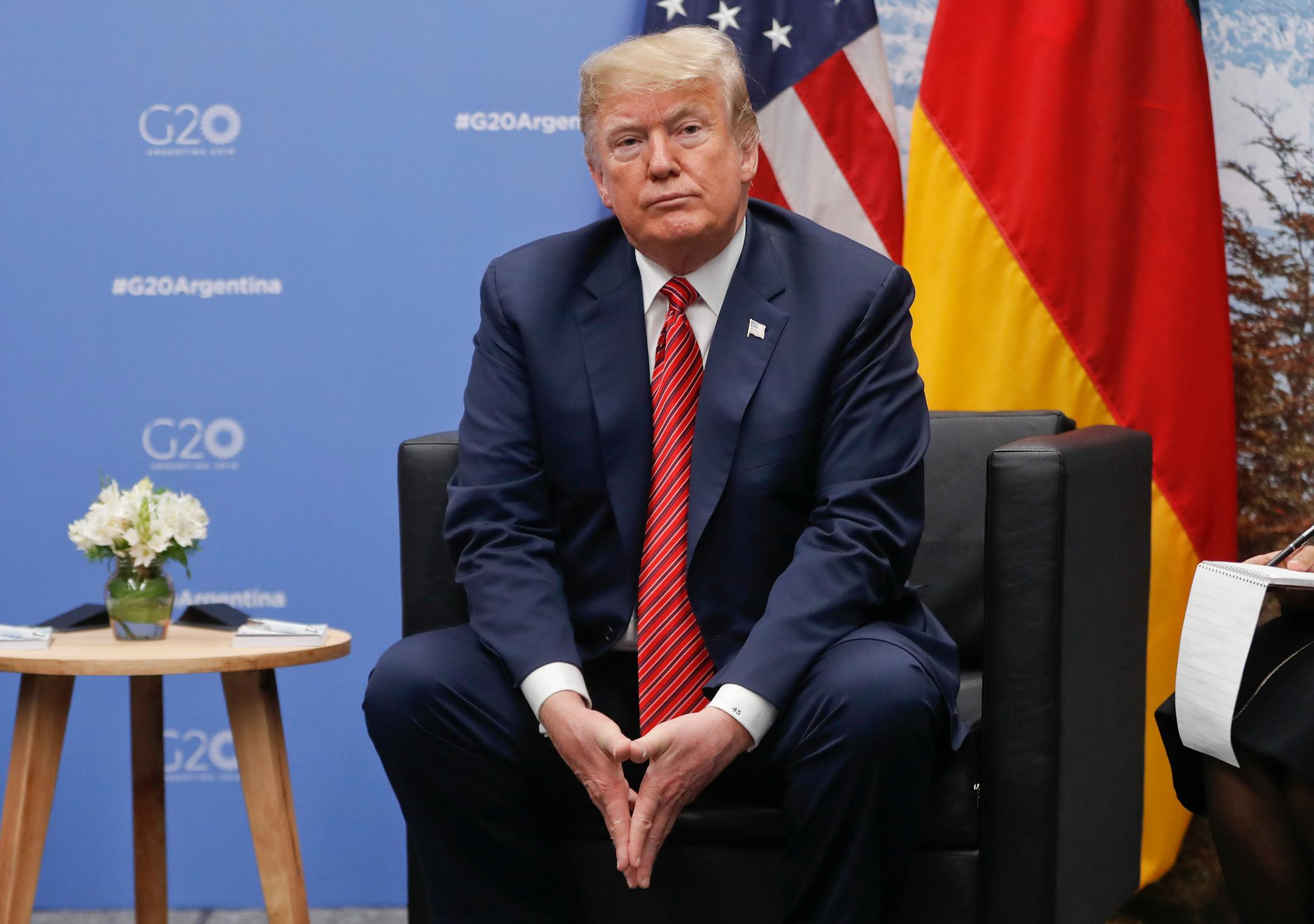 President Donald Trump listens to questions from members of the media during his meeting with Germany's Chancellor Angela Merkel at the G20 Summit, Saturday, Dec. 1, 2018 in Buenos Aires, Argentina.
