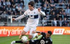 Minnesota United defender D.J. Taylor knocked Vancouver Whitecaps forward Brian White (24) off the ball on Oct. 9 at Allianz Field.
