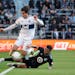 Minnesota United defender DJ Taylor, bottom, knocked Vancouver forward Brian White and the ball out of bounds in their game Sunday at Allianz Field.