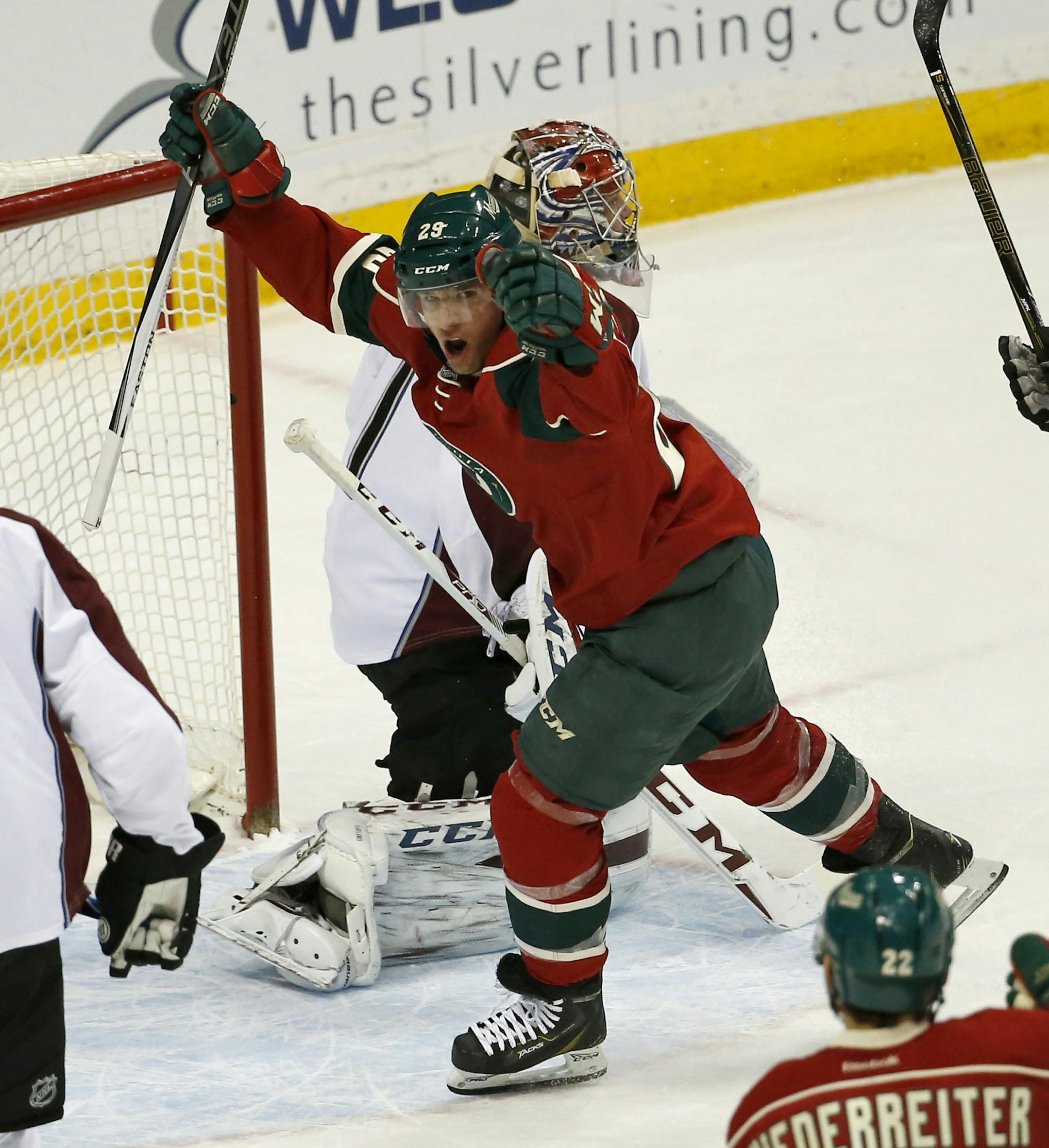 Minnesota Wild right wing Jason Pominville (29) celebrates after scoring on Colorado Avalanche goalie Semyon Varlamov, rear, of Russia, during the first period of an NHL hockey game in St. Paul, Minn., Tuesday, March 1, 2016. (AP Photo/Ann Heisenfelt)