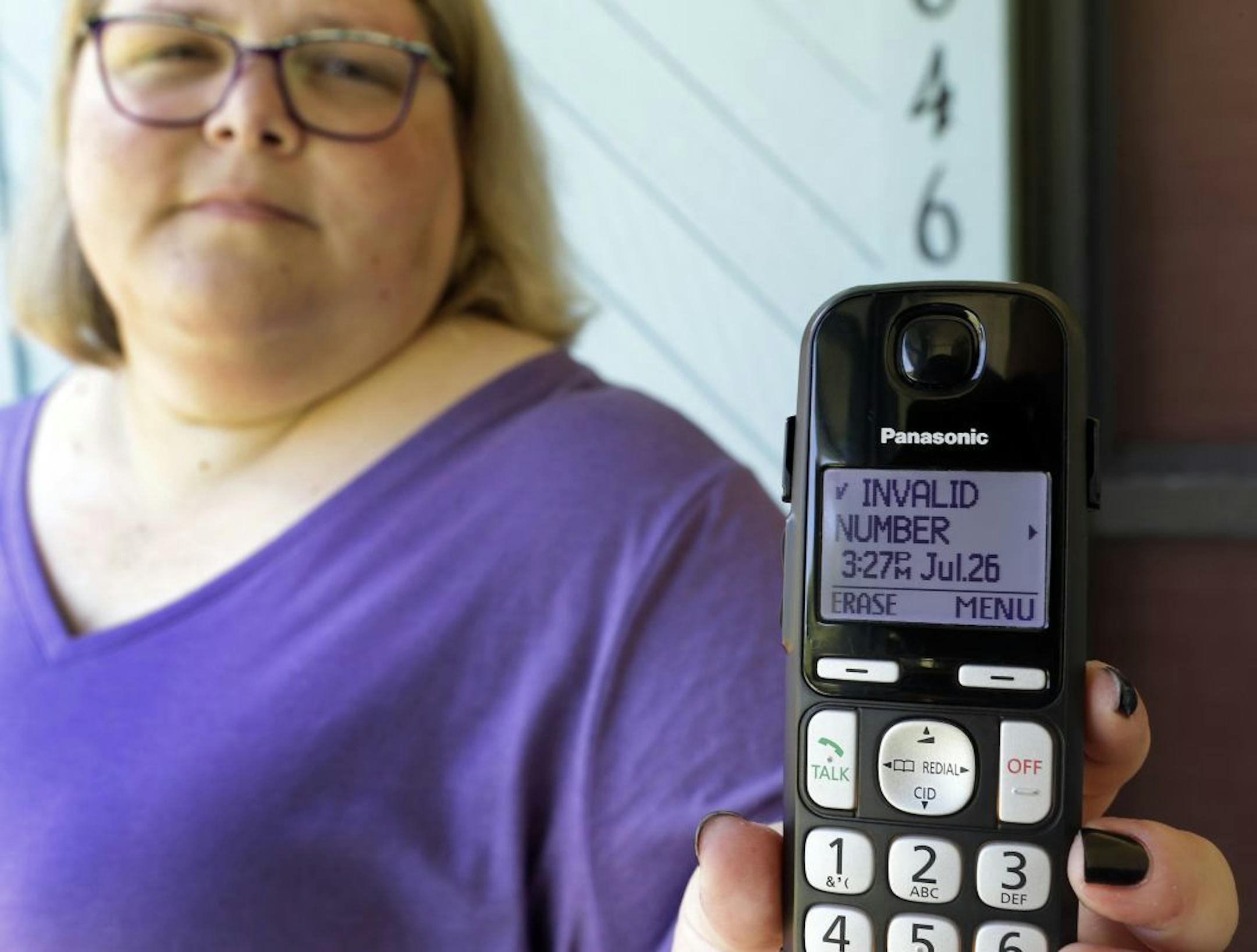 In this Tuesday, Aug. 1, 2017, photo, Jen Vargas shows the data of a recent robocall on her home phone in Orlando, Fla. Vargas has an app for her cellphone that helps locate and block fraudulent calls, although she doesn't know what to do on the home phone other than ignore those calls.