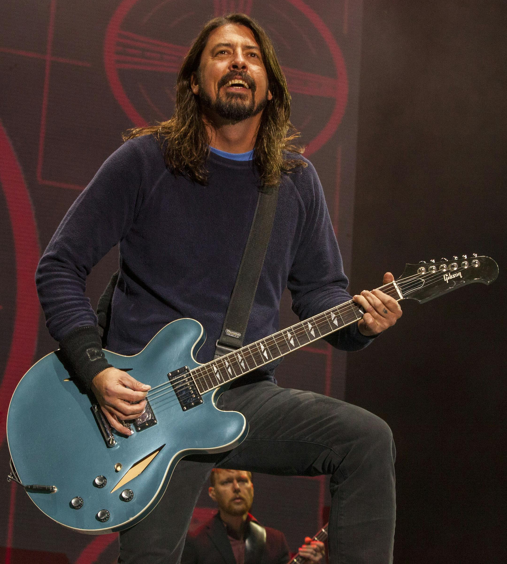 FILE - In this Nov. 2, 2014 file photo, Dave Grohl of the Foo Fighters performs at the Voodoo Music Experience in New Orleans. Grohl managed to finish a concert with a broken ankle, but he canít finish the Foo Fighters tour. The Foo Fighters announced Tuesday, June 16, 2015, that theyíre canceling the rest of their European tour after Grohl was injured in fall on stage in Sweden on Friday, June 12. (Photo by Barry Brecheisen/Invision/AP, File)
