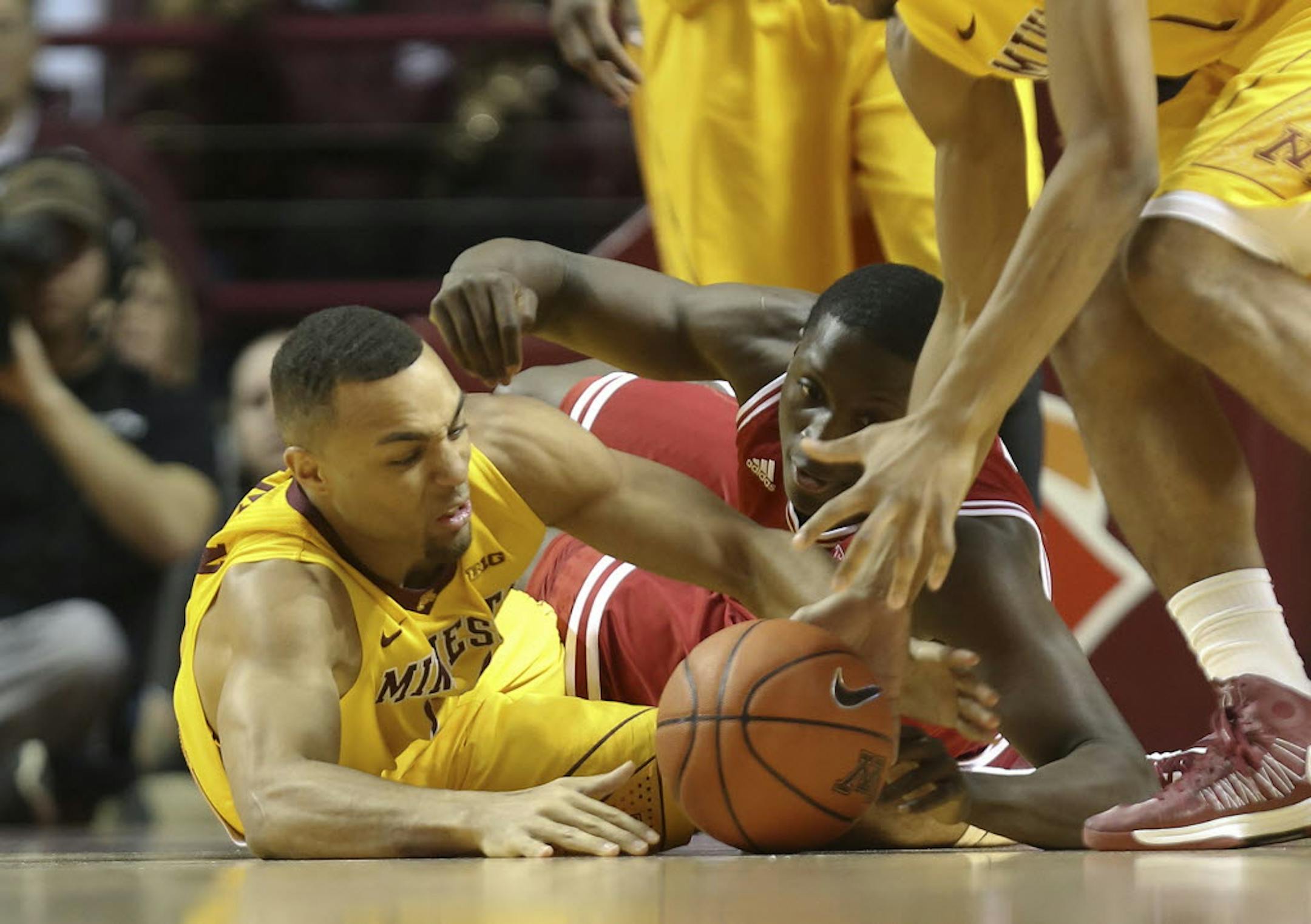 Minnesota's Joe Coleman fought for possession of the ball with Indiana's Victor Oladipo on Tuesday night.